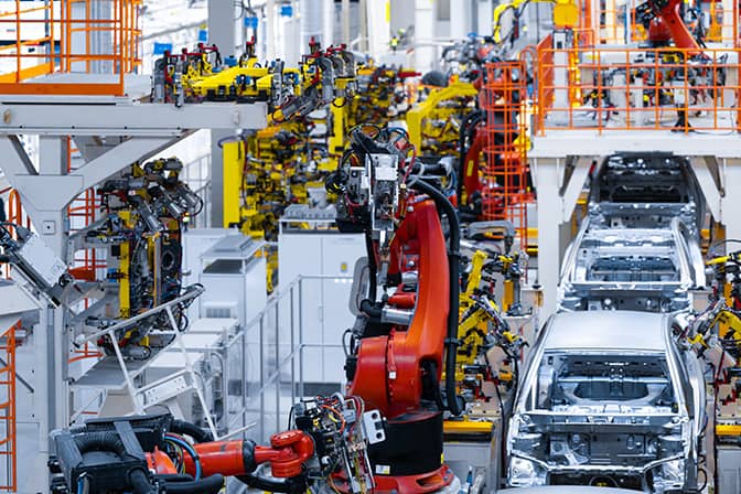 Robotic arms on a automobile manufacurer assembly line