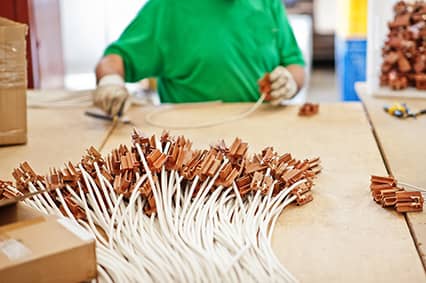 worker attaching wires with connectors to iso standard