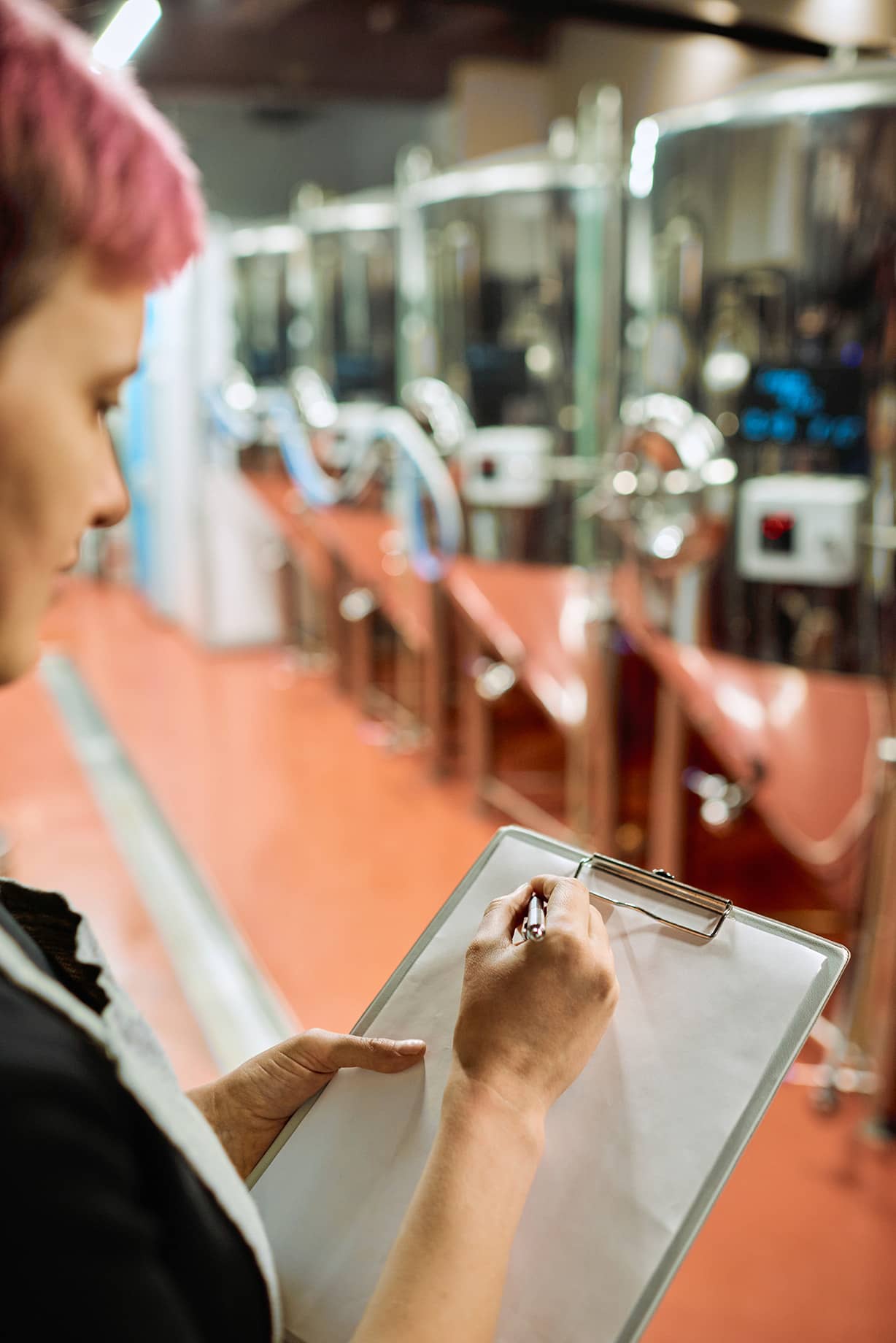 woman checking Quality standards on a checklist